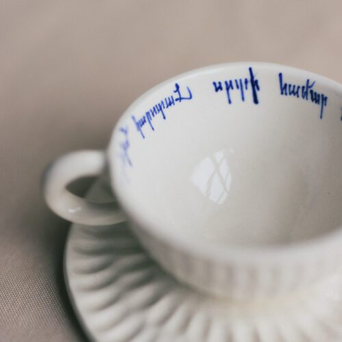 Handled cup and saucer set